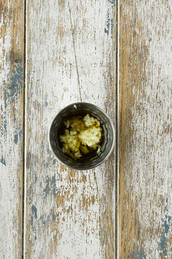 Step two is adding the minced garlic to the oil so that it doesn burn.