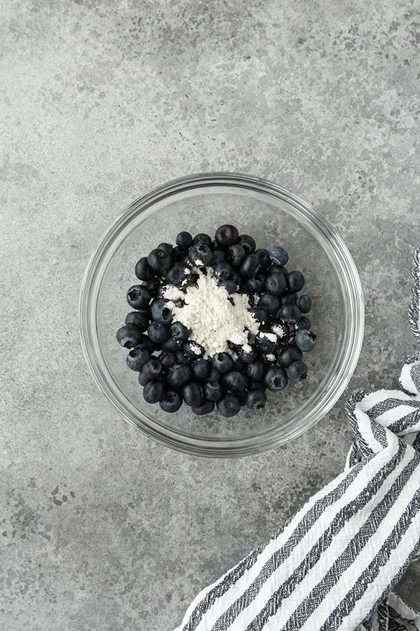 Step one is coating the blueberries in a little flour.