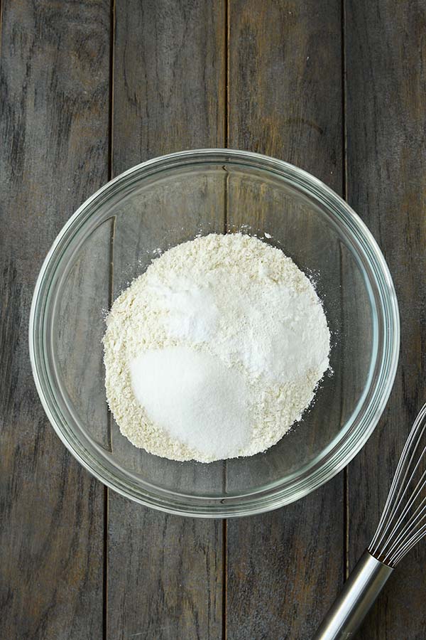 Step one is a glass bowl with all of the dry ingredients and a whisk.