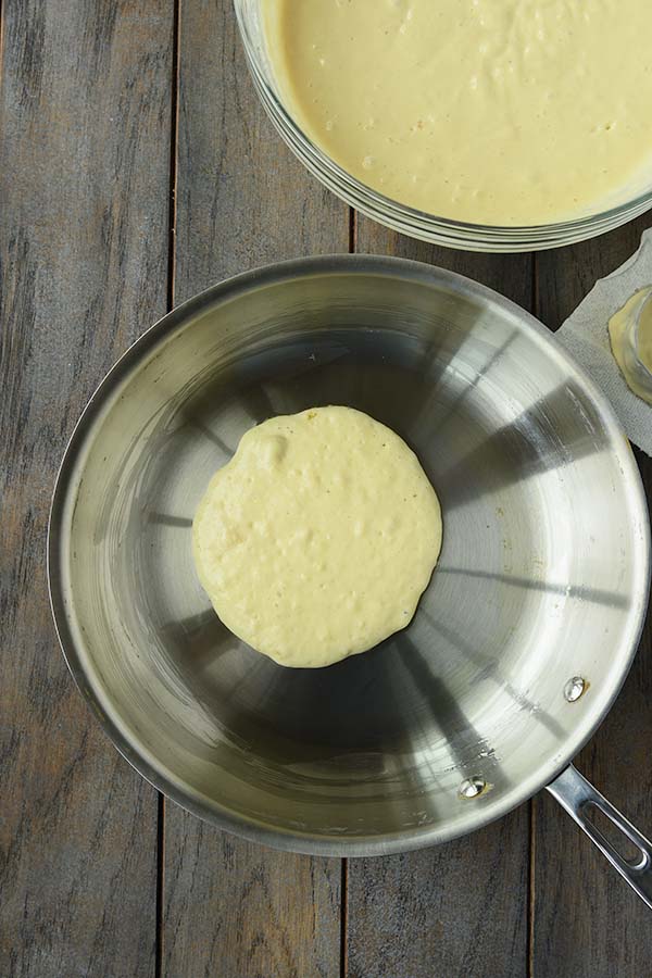 Step four is a hot pan with 1/3 cup of batter poured in.