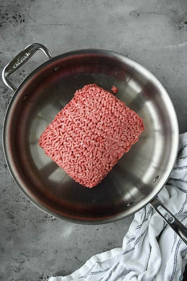 Step one is a pan cooking the ground beef.
