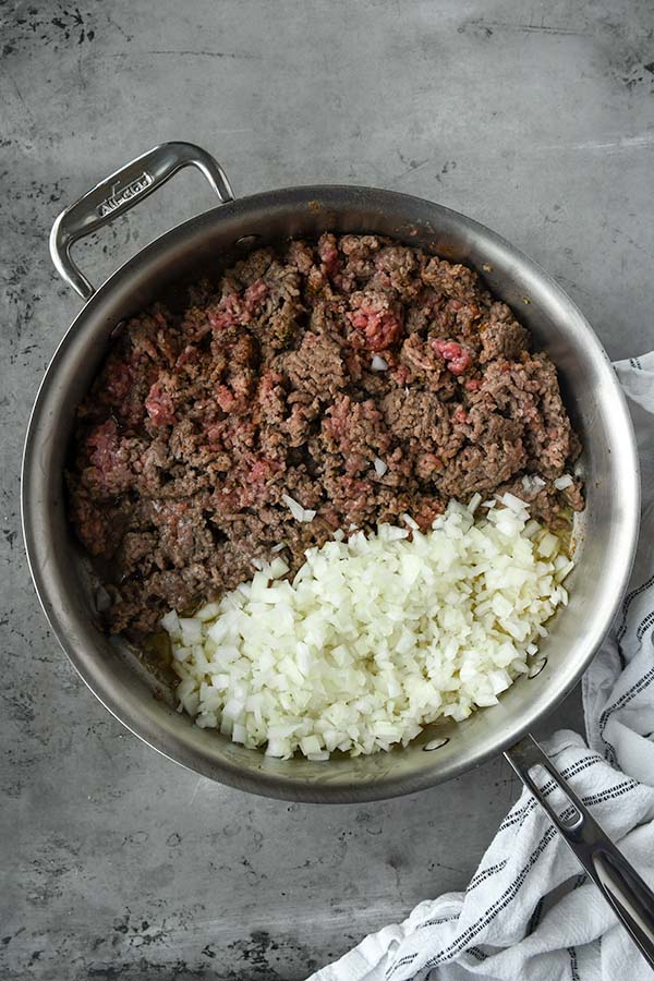 Step two is the ground beef and onions in the pan.