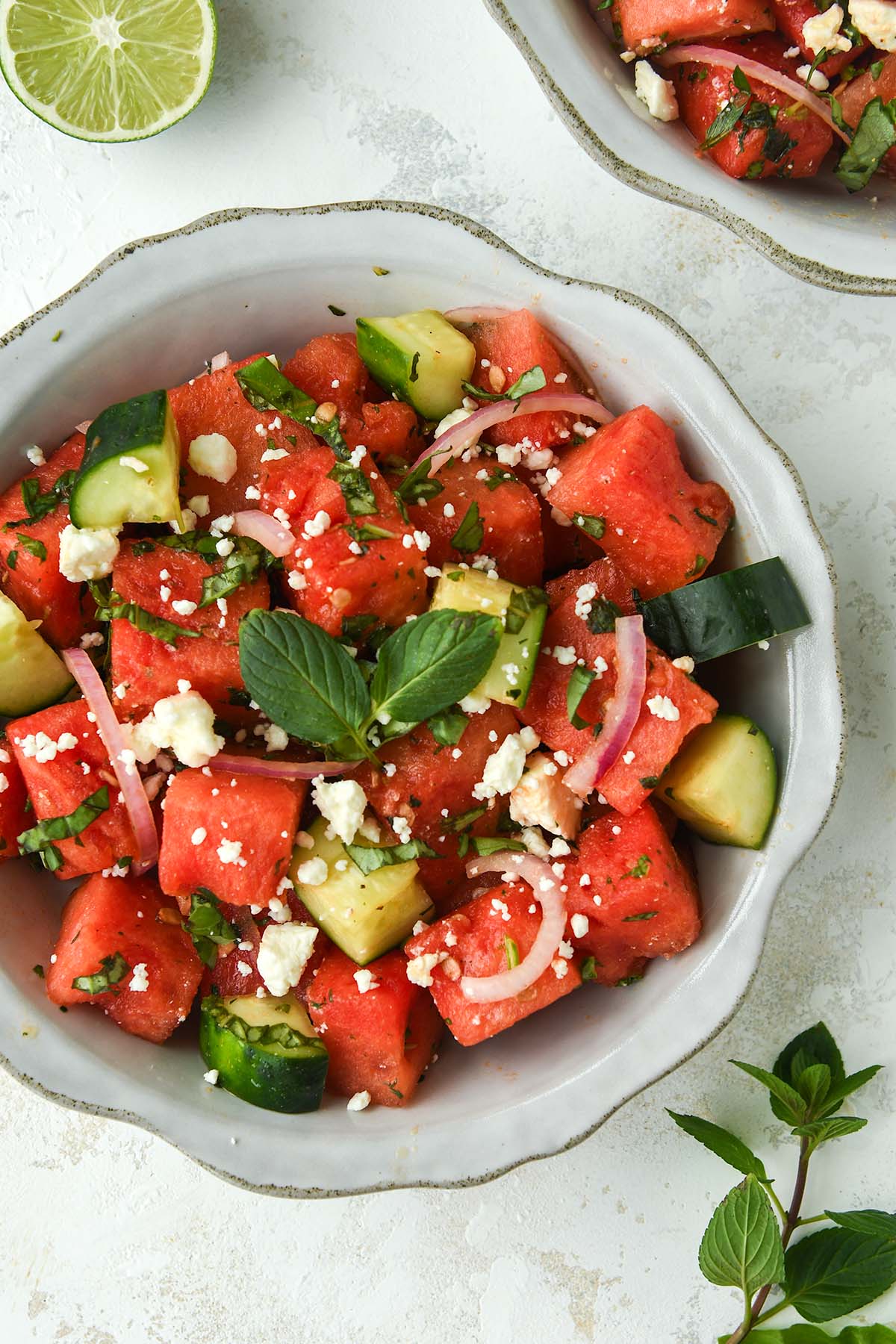 Above view of watermelong salad with some mint leaves.
