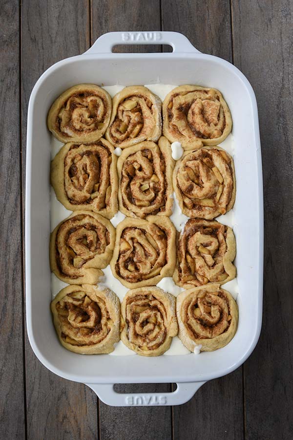 Step 10 is the heavy whipping cream poured over edges of the rolls.