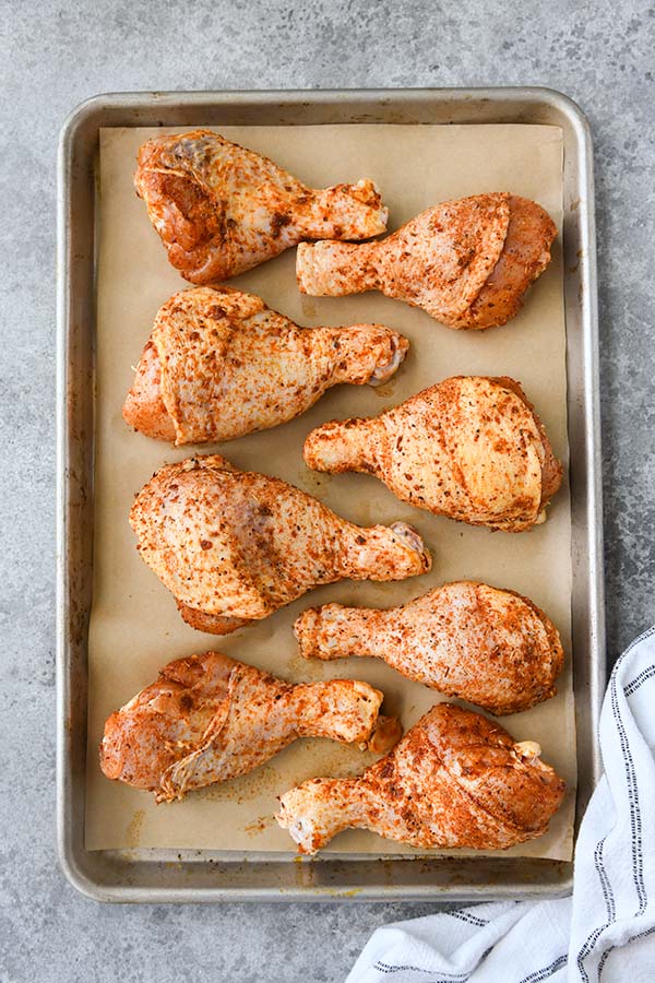 Step four is the chicken legs lied out on the baking sheet.