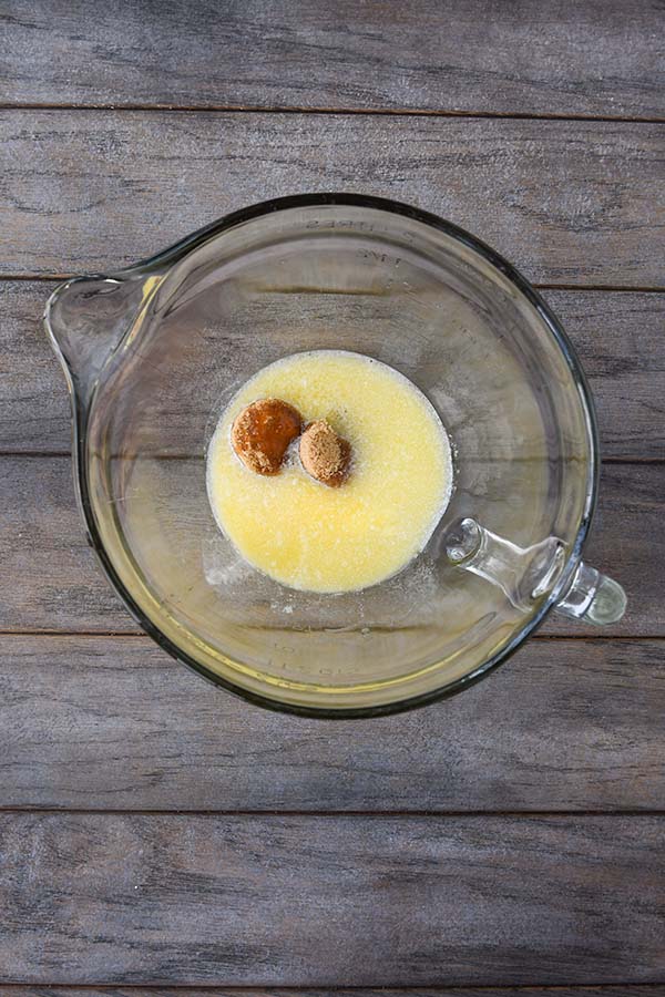 Step two is a separate glass bowl with melted butter, honey, and the brown sugar added.