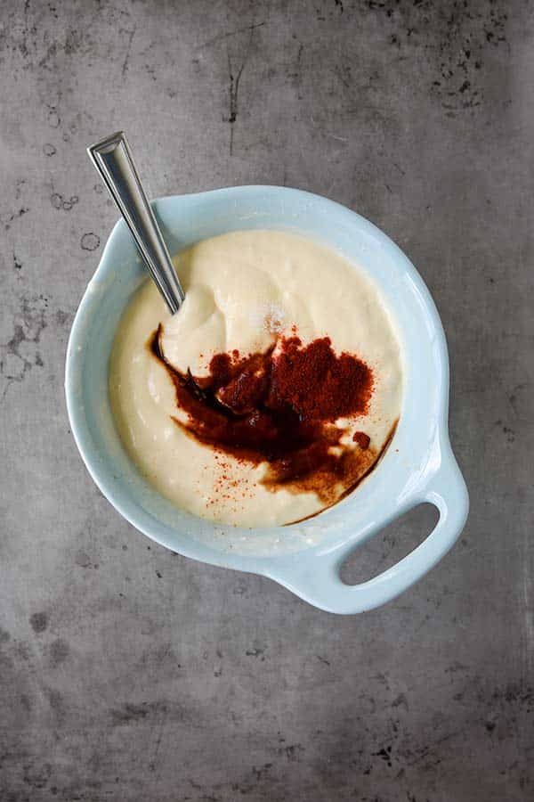 Step two is a small blue bowl with all of the sauce ingredients added.