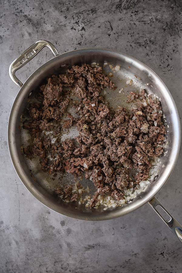 Step three is the cooked ground beef with the garlic, salt, pepper, and onion mixed in.