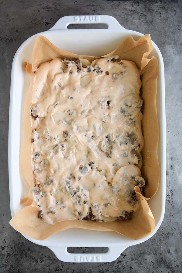 Step six is the sauce added on top of the ground beef.