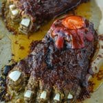 Up close of Halloween feetloaf on a baking tray.