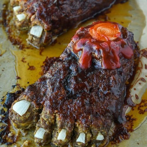 Up close of Halloween feetloaf on a baking tray.