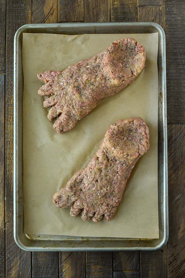Step four is forming two feet out of the mixture on a parchment paper lined baking sheet.