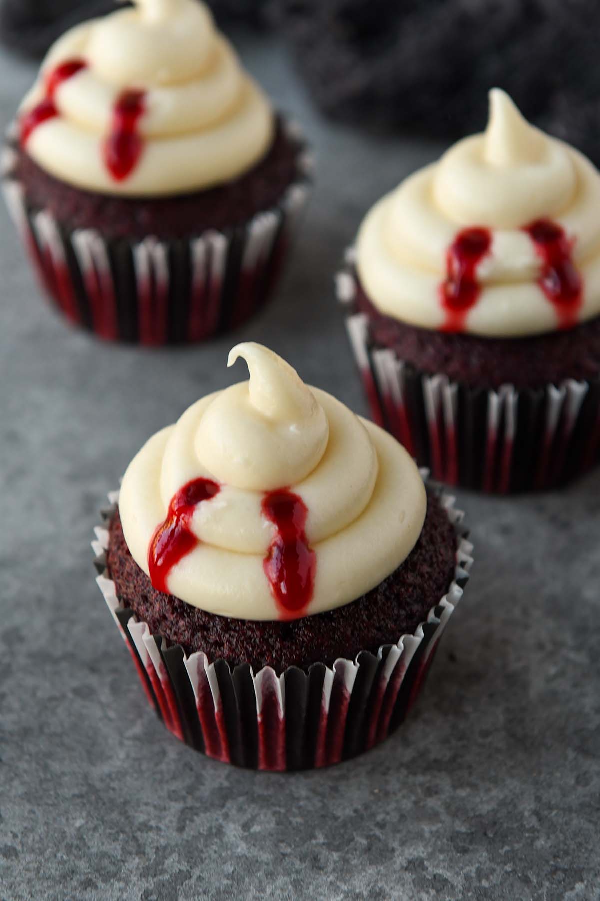 Three vampire bitten cupcakes