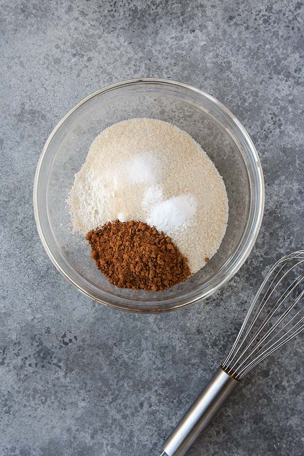 Step one is the dry ingredients in a mixing bowl with a whisk.