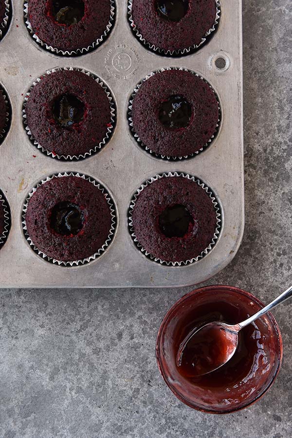 Step seven is the raspberry jam added to the inside of each cupcake.