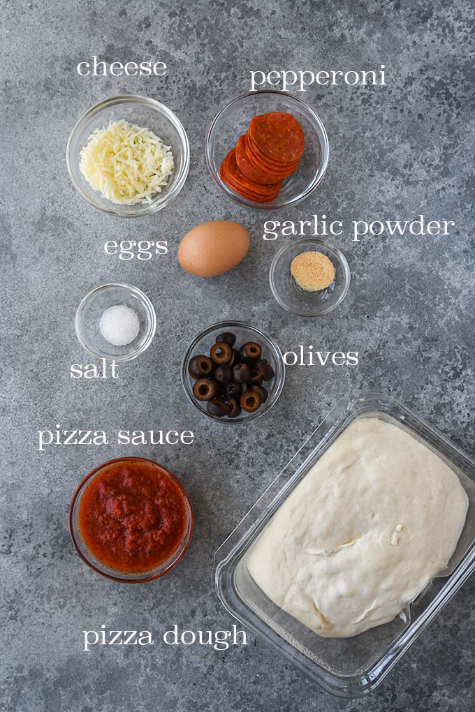 All of the ingredients to make this pizza mummy.