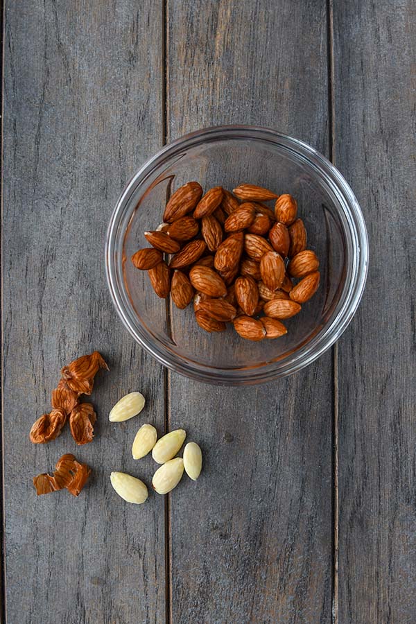Step one is a bowl of blanched almonds with some of the peels taken off.